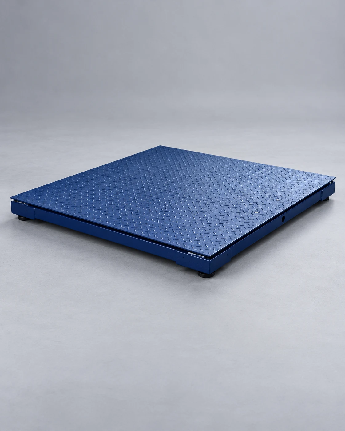 Blue industrial floor scale with a diamond-tread steel deck