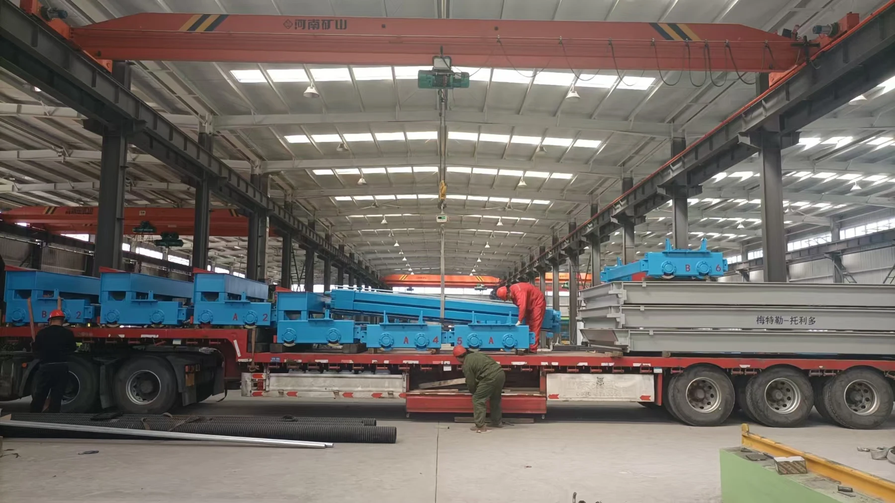 Weighbridge structures loaded onto a truck in a production workshop